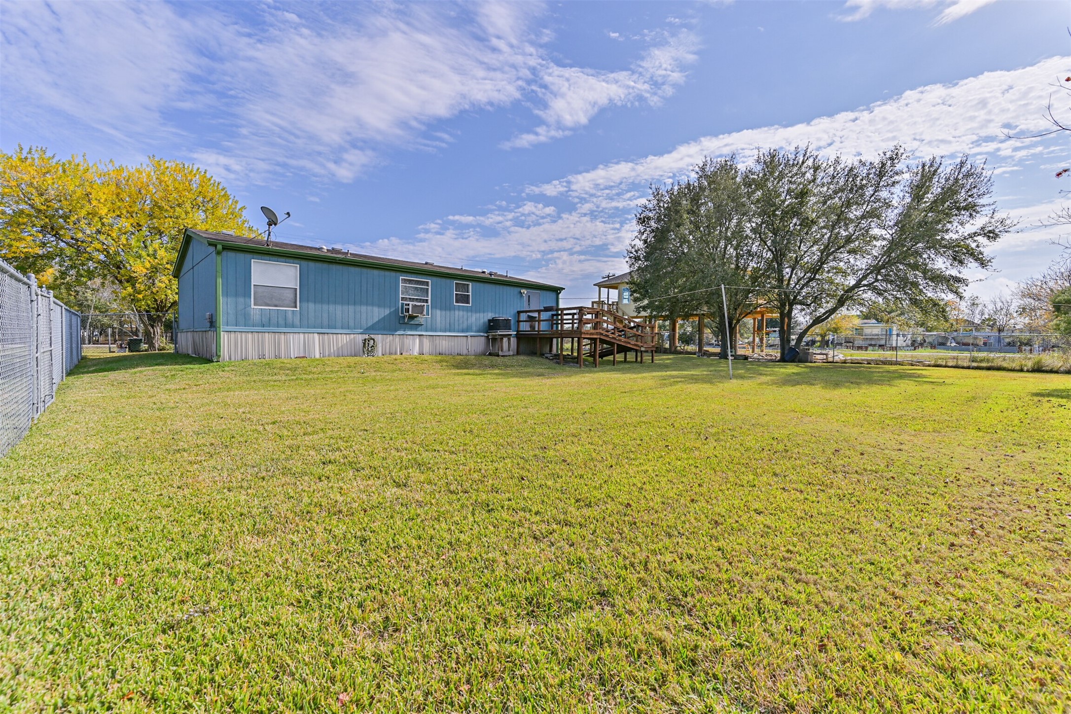 1036 9th Street Dickinson, TX 77539 - Photo 3 of 29 a view of a swimming pool with an outdoor space and seating area
