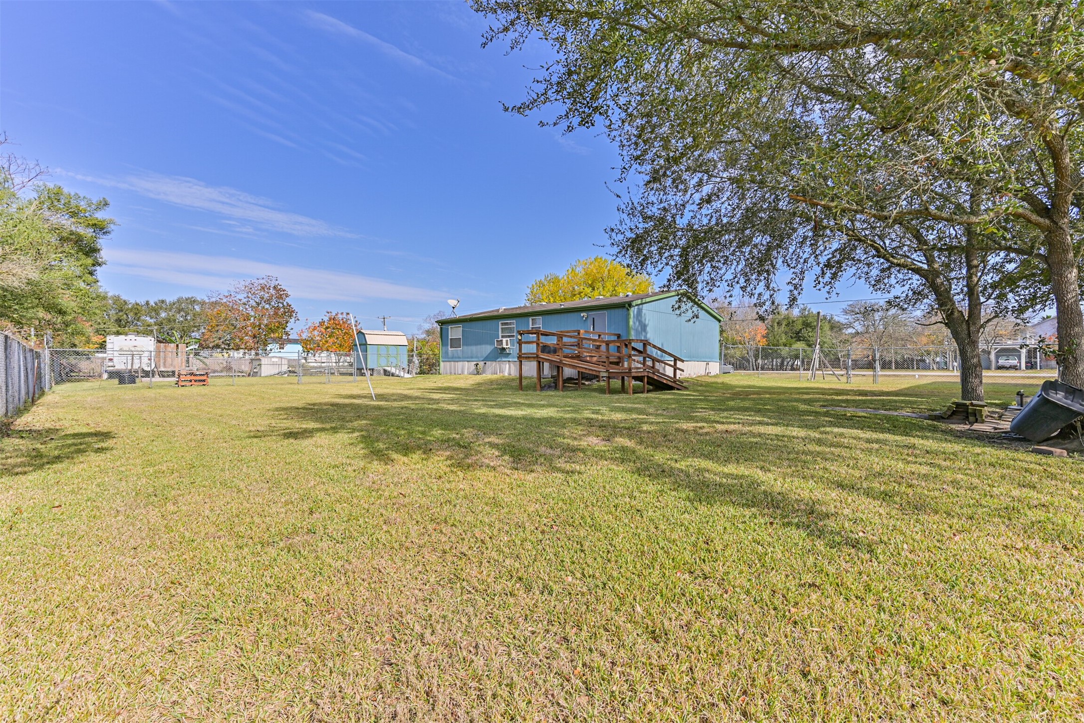 1036 9th Street Dickinson, TX 77539 - Photo 4 of 29 a view of a town with palm trees