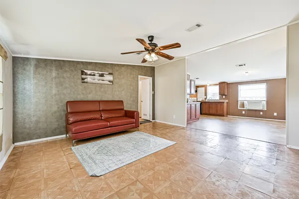 a living room with furniture and a rug