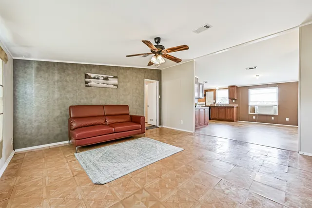 a living room with furniture and a rug