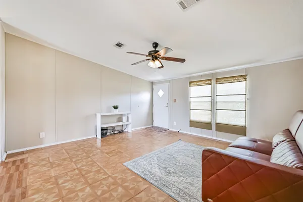a living room with furniture and a window