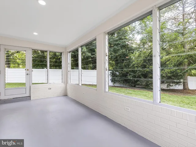 a view of an empty room with a large window