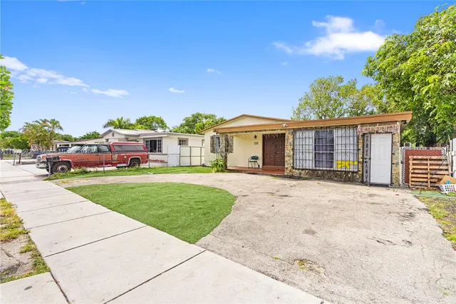 a view of a house with a garden
