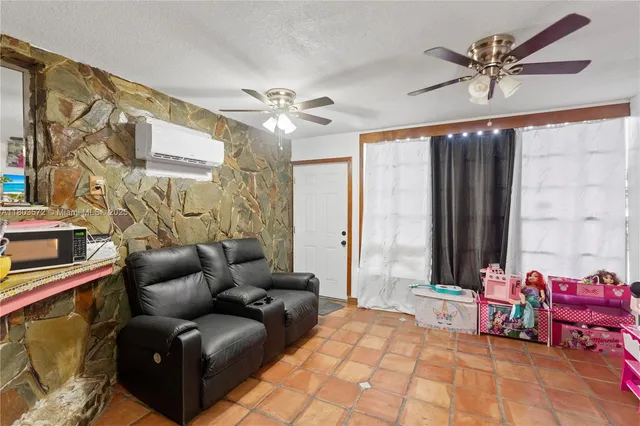 a bedroom with furniture and a chandelier