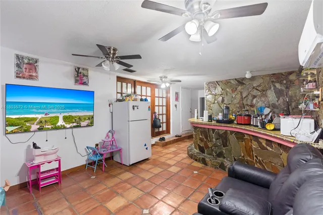 a view of a dining room with furniture and a chandelier