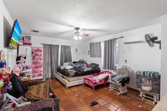 a bedroom with furniture and a chandelier
