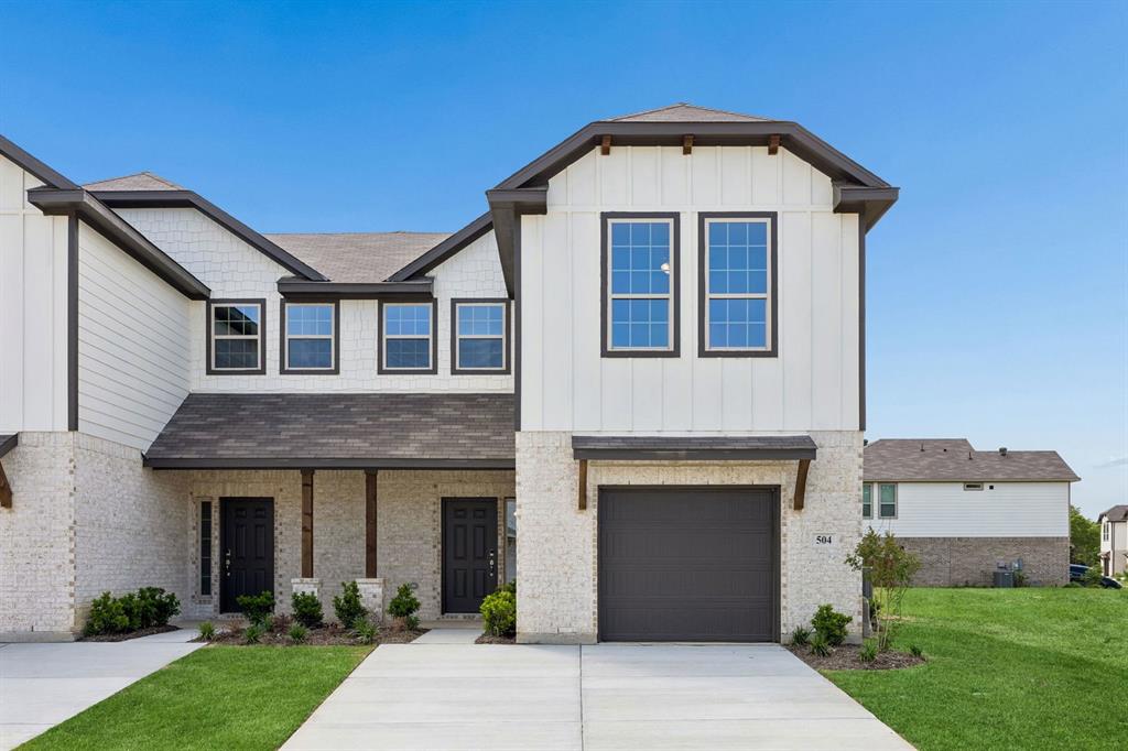 504-506 Mockingbird Lane Denton, TX 76209 - Photo 1 of 30 a front view of a house with a yard and garage