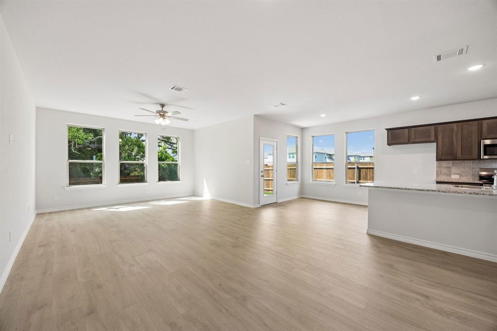 504-506 Mockingbird Lane Denton, TX 76209 - Photo 13 of 30 a view of empty room with wooden floor and windows
