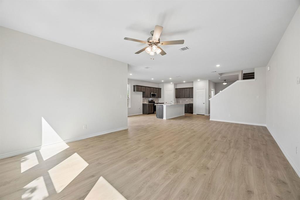 504-506 Mockingbird Lane Denton, TX 76209 - Photo 14 of 30 a view of a kitchen with a sink and a ceiling fan