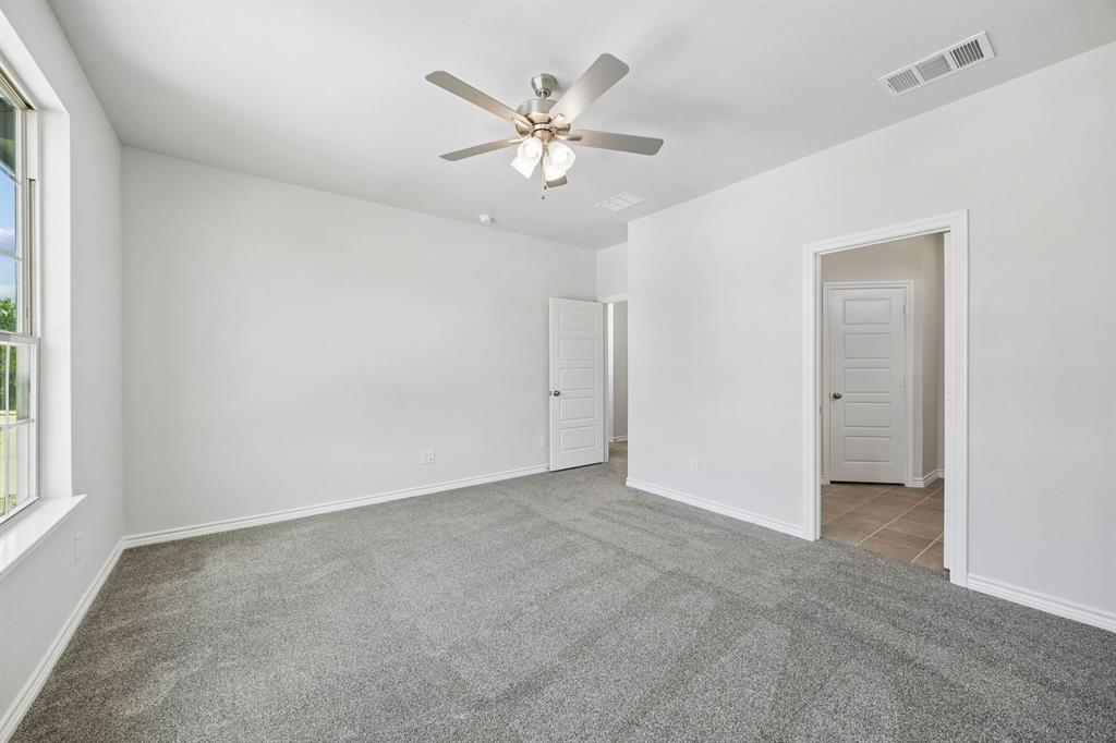 504-506 Mockingbird Lane Denton, TX 76209 - Photo 18 of 30 an empty room with closet and windows