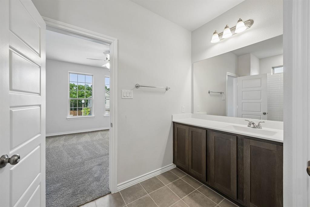 504-506 Mockingbird Lane Denton, TX 76209 - Photo 21 of 30 a spacious bathroom with a double vanity sink mirror and
