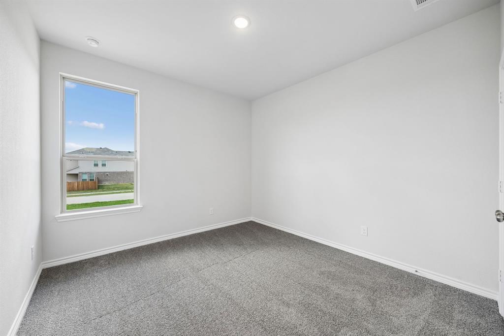 504-506 Mockingbird Lane Denton, TX 76209 - Photo 22 of 30 an empty room with windows