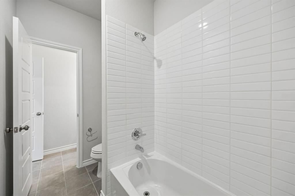504-506 Mockingbird Lane Denton, TX 76209 - Photo 26 of 30 a bathroom with a bathtub and shower
