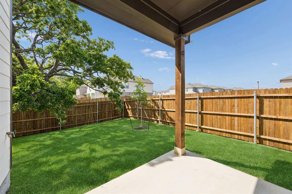 504-506 Mockingbird Lane Denton, TX 76209 - Photo 28 of 30 a view of a backyard with wooden fence