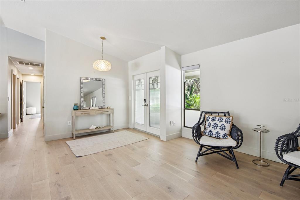 3390 Bayou Sound Longboat Key, FL 34228 - Photo 15 of 59 a living room with furniture and a table