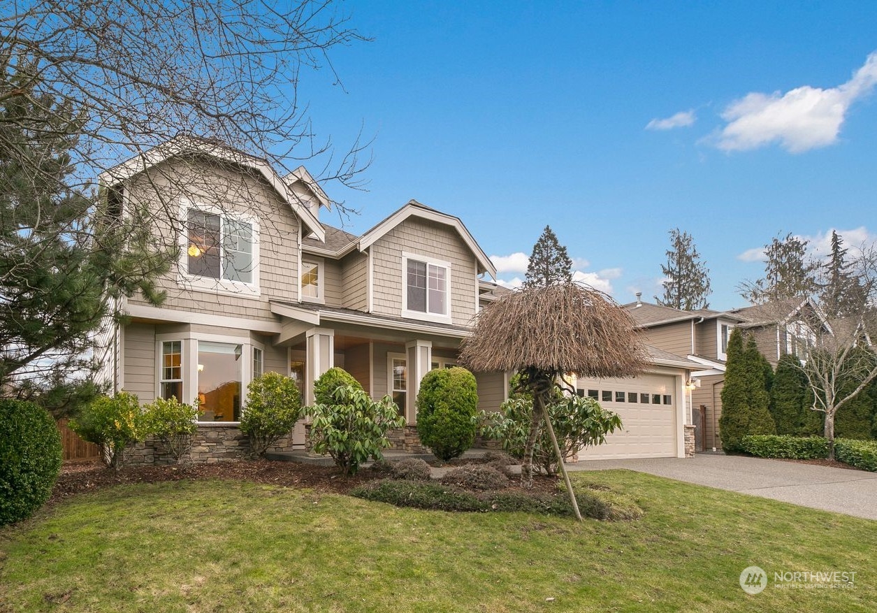 9912 Northeast 151st Street Bothell, WA 98011 - Photo 31 of 33 a front view of a house with a yard