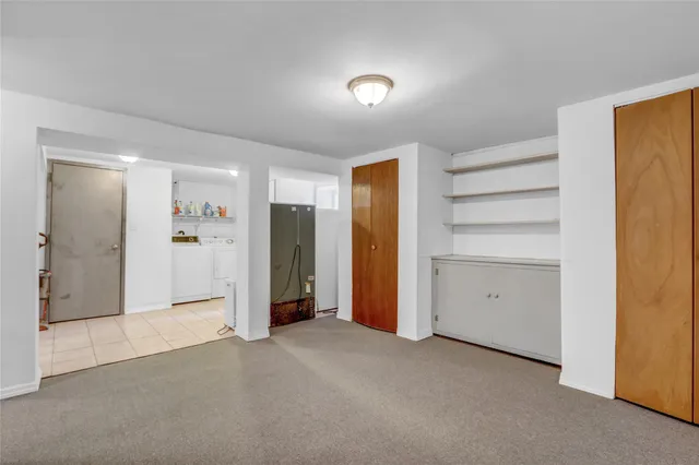 a view of empty room with closet