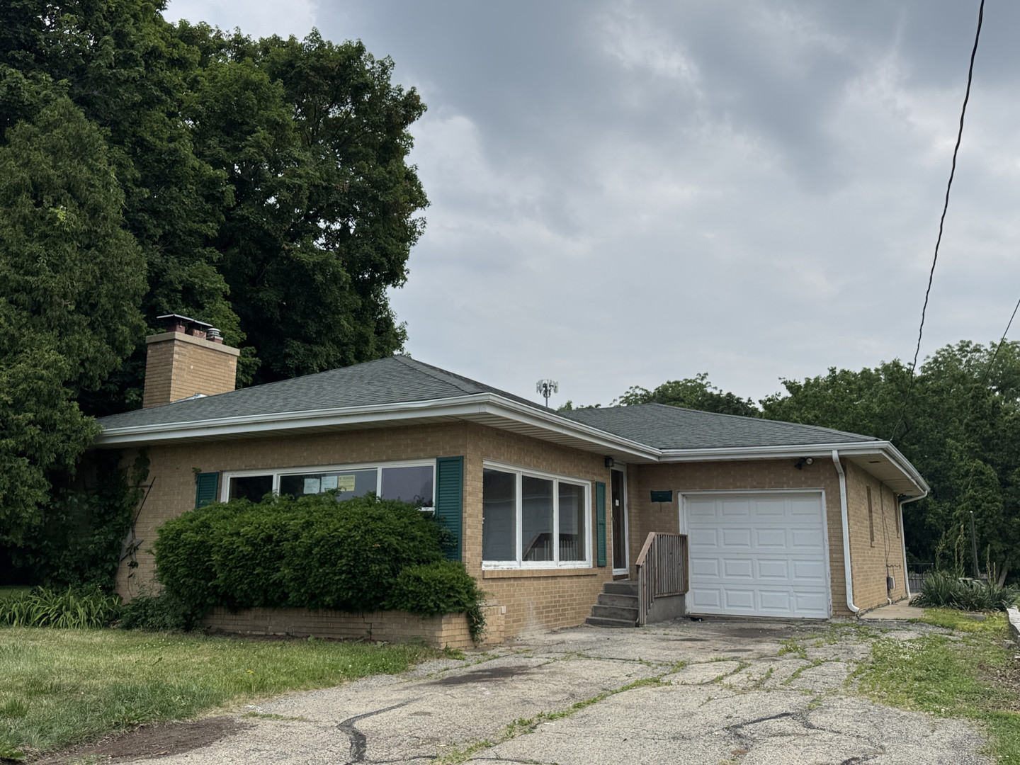 2024 Montague Road Rockford, IL 61102 - Photo 1 of 34 a front view of a house with a garden