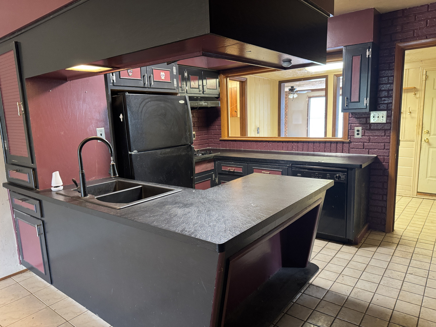 2024 Montague Road Rockford, IL 61102 - Photo 12 of 34 a kitchen with a sink a stove and a refrigerator