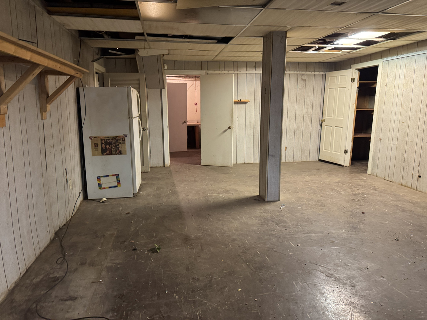 2024 Montague Road Rockford, IL 61102 - Photo 26 of 34 a view of a hallway with wooden walls