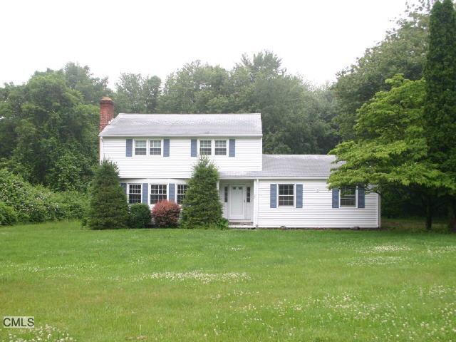 33 Walnut Grove Road Ridgefield, CT 06877 - Photo 1 of 1 a view of a house next to a big yard and large trees
