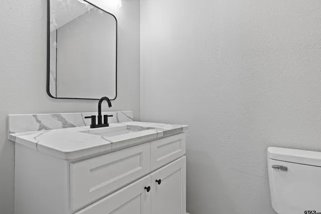 a bathroom with a sink and a vanity