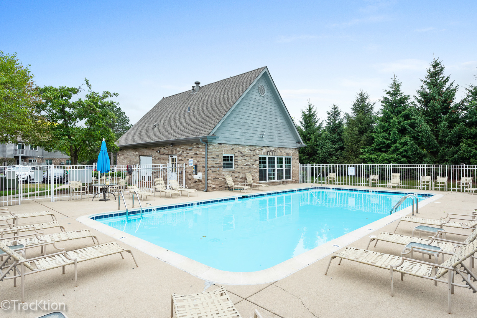 31 Foxcroft Road, Unit 207 Naperville, IL 60565 - Photo 6 of 6 a view of a house with swimming pool