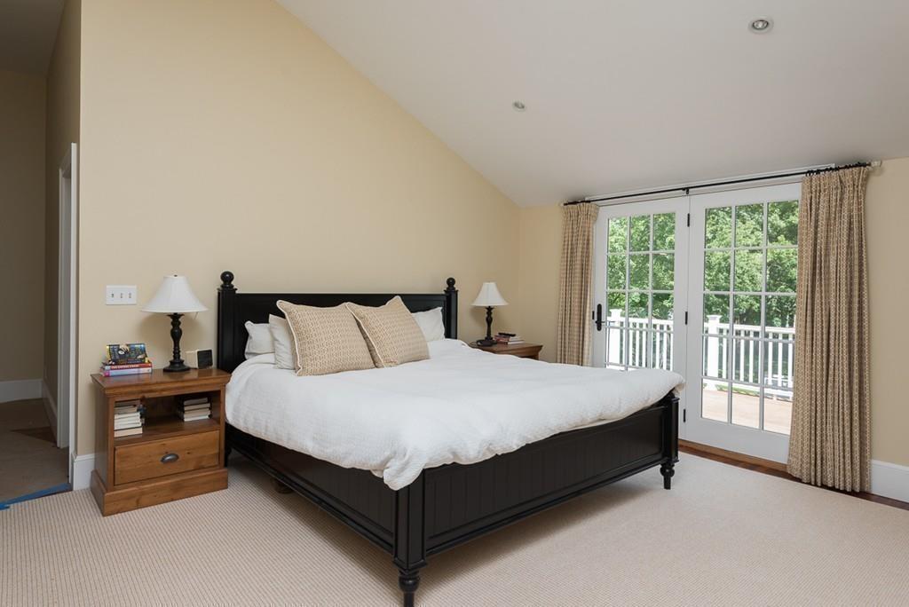 44 Middle Street Hingham, MA 02043 - Photo 13 of 23 a large bed sitting in a bedroom next to a window