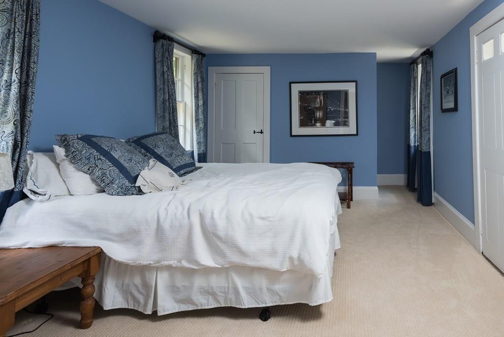 44 Middle Street Hingham, MA 02043 - Photo 19 of 23 a bedroom with a bed and a painting on the wall