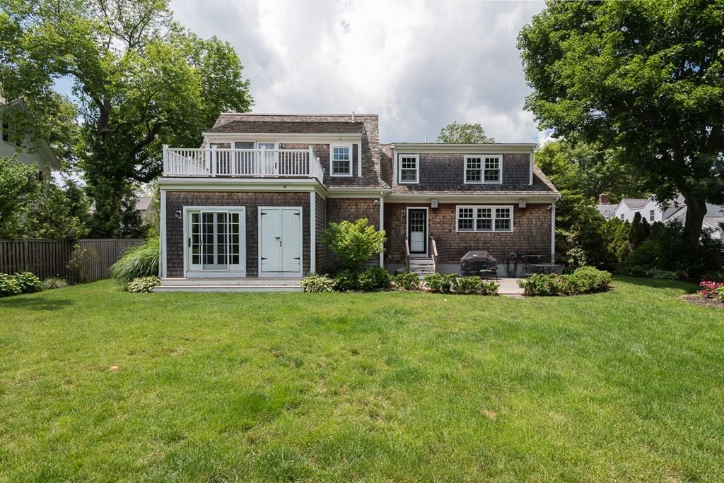 44 Middle Street Hingham, MA 02043 - Photo 23 of 23 front view of a house with a garden