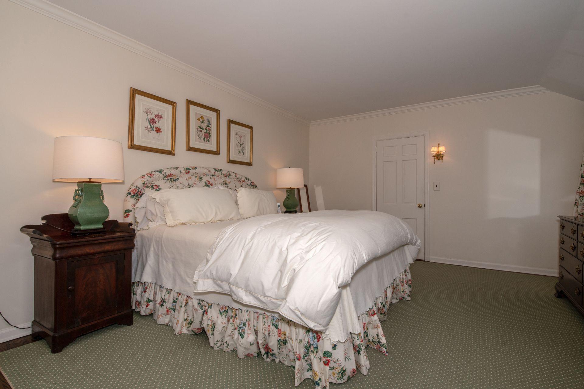 20 Colony Road Darien, CT 06820 - Photo 22 of 34 a bedroom with a bed and a lamp on the dresser