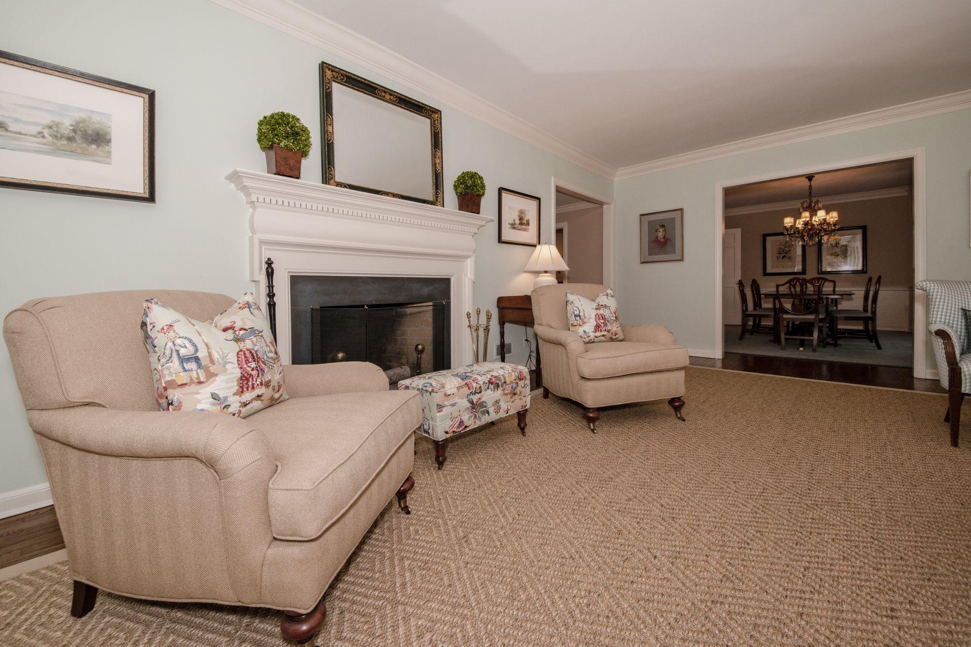 20 Colony Road Darien, CT 06820 - Photo 8 of 34 a living room with furniture and a fireplace