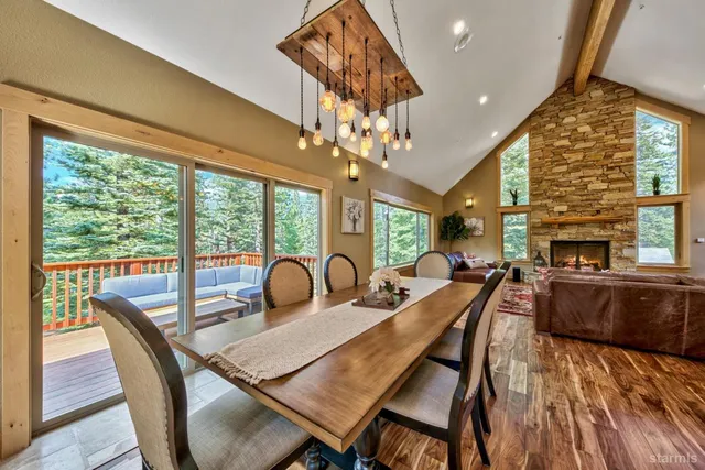 a view of balcony with wooden floor and outdoor seating