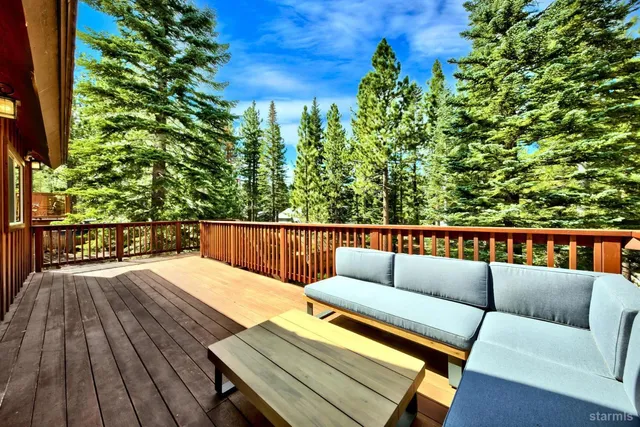 a kitchen with stainless steel appliances kitchen island granite countertop a stove a sink and a refrigerator