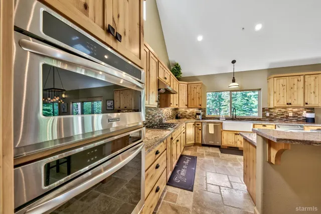 a spacious bathroom with double vanity and a mirror