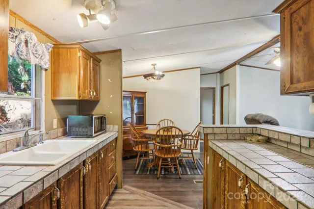 a view of a kitchen area with furniture and chandelier