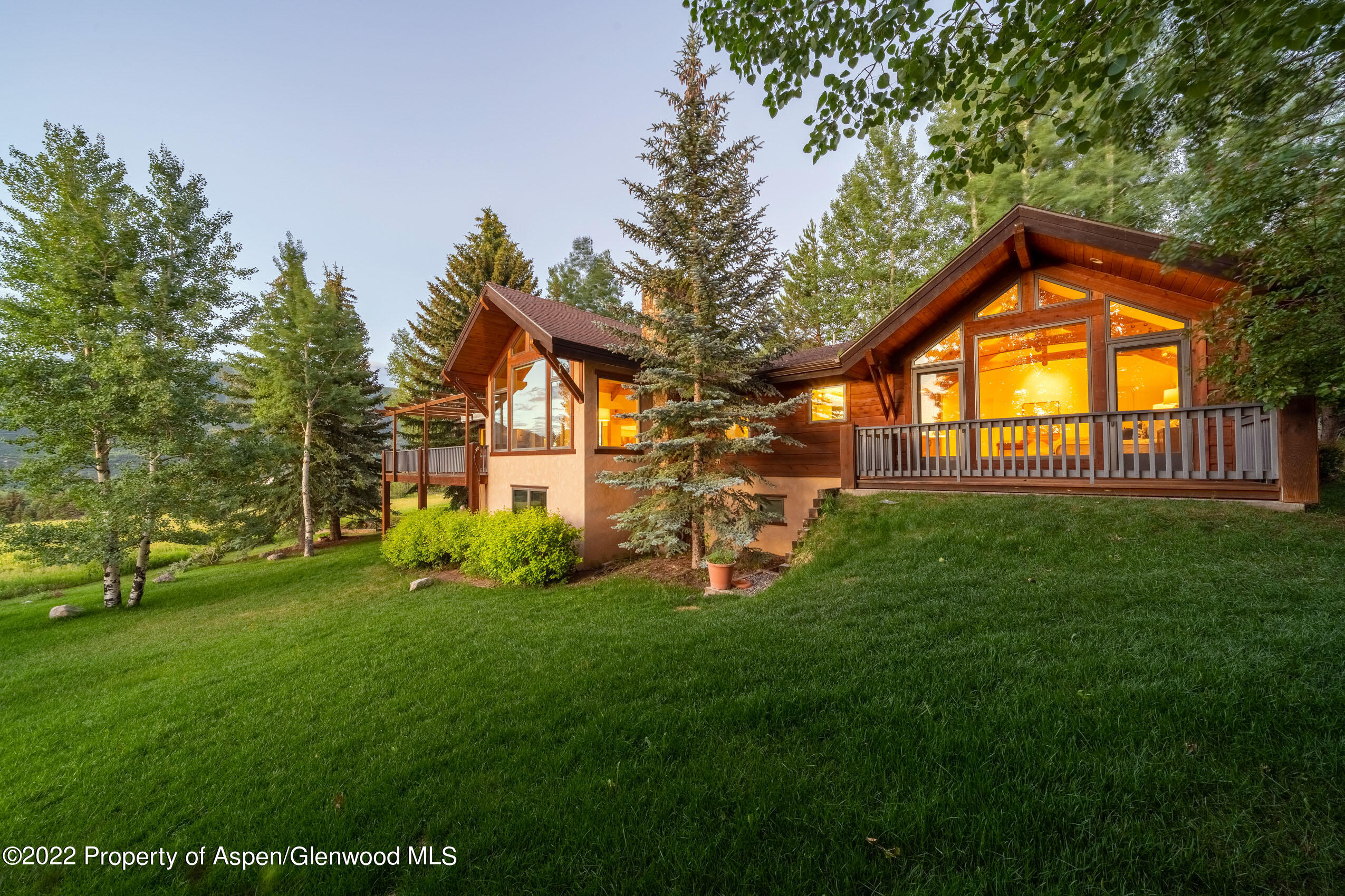 61 Primrose Path Aspen, CO 81611 - Photo 19 of 48 a view of a house with a yard