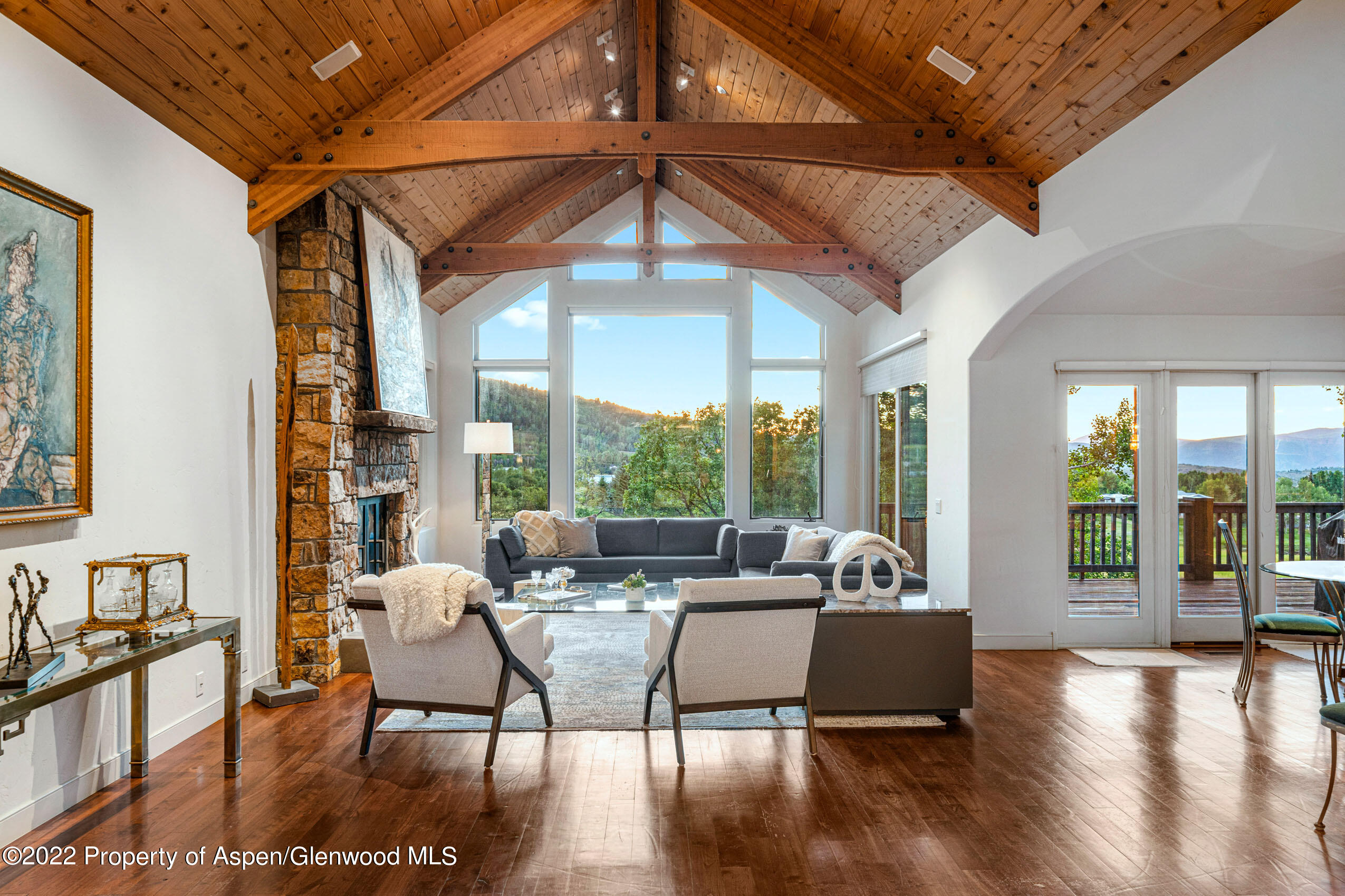 61 Primrose Path Aspen, CO 81611 - Photo 21 of 48 a living room with fireplace furniture and a large window
