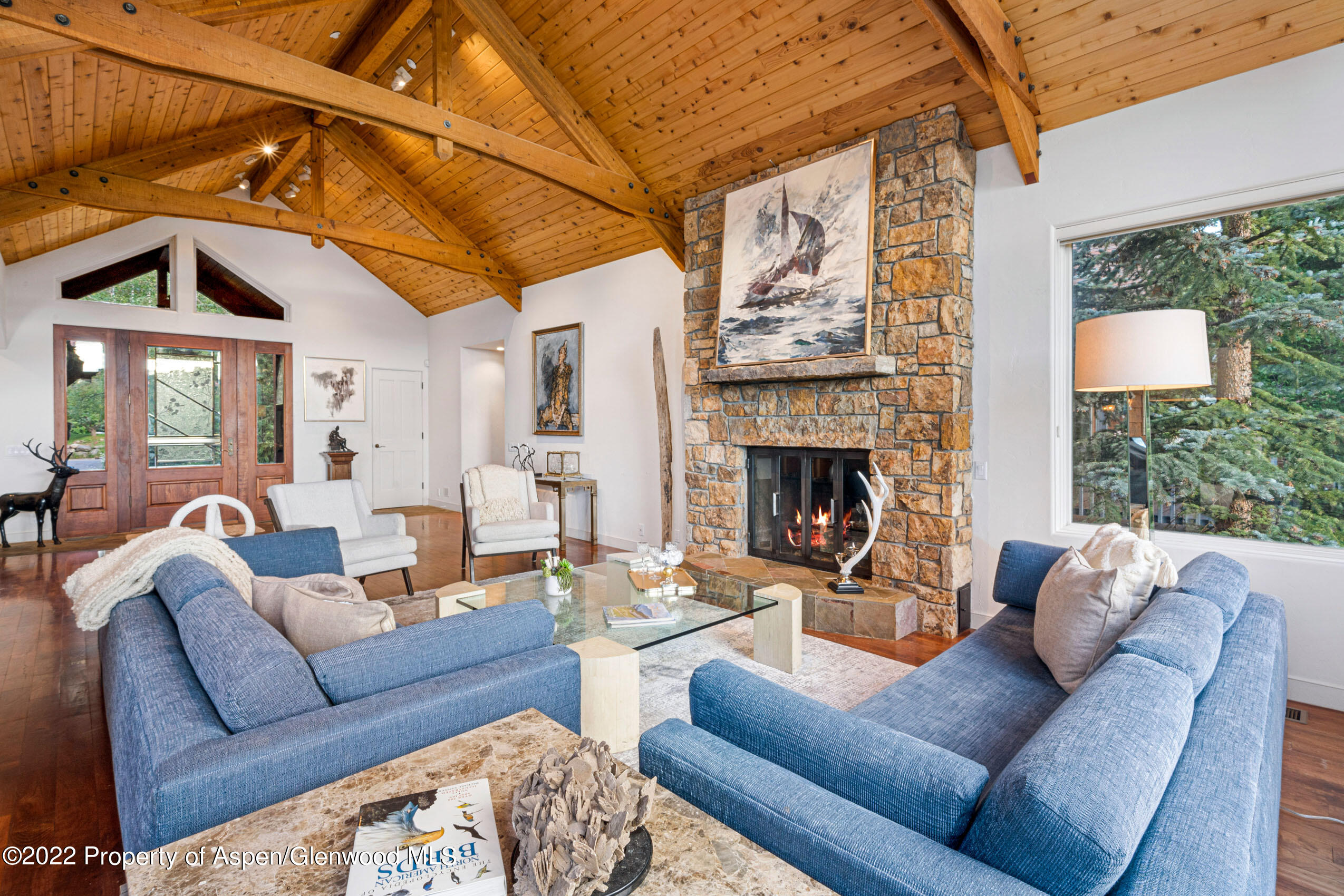 61 Primrose Path Aspen, CO 81611 - Photo 32 of 48 a living room with furniture fireplace and a window