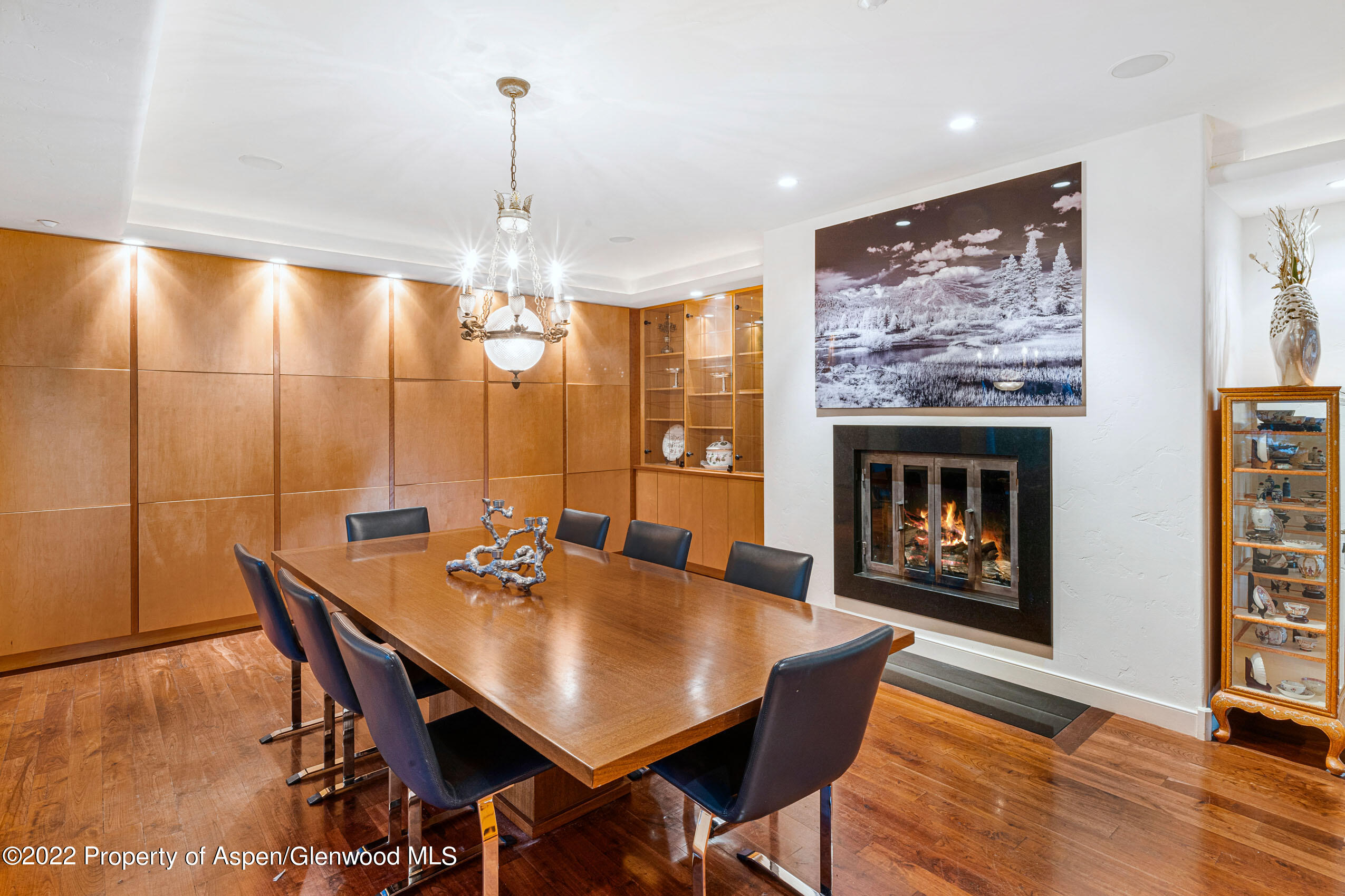 61 Primrose Path Aspen, CO 81611 - Photo 39 of 48 a dining room with furniture a chandelier and wooden floor
