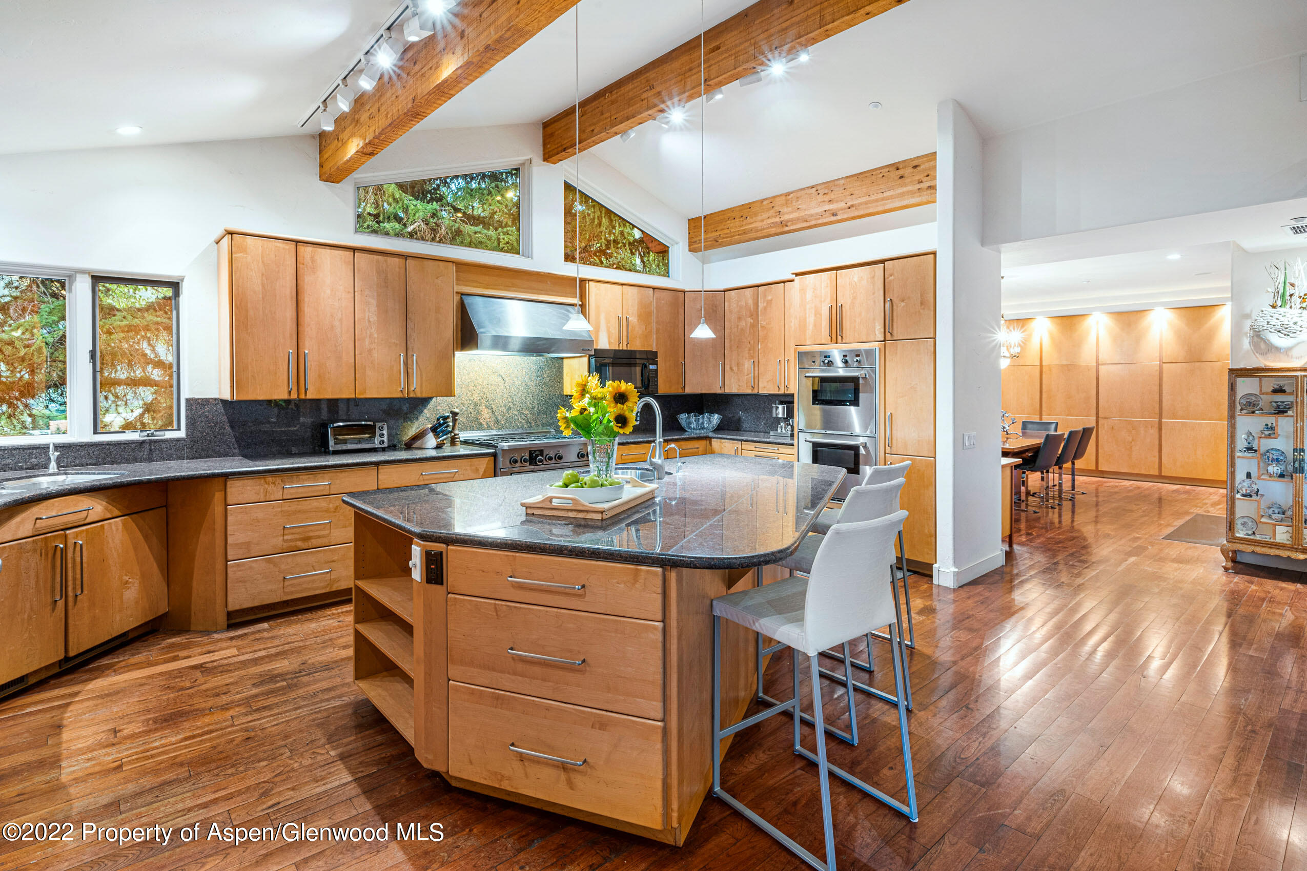61 Primrose Path Aspen, CO 81611 - Photo 41 of 48 a kitchen with sink cabinets and wooden floor