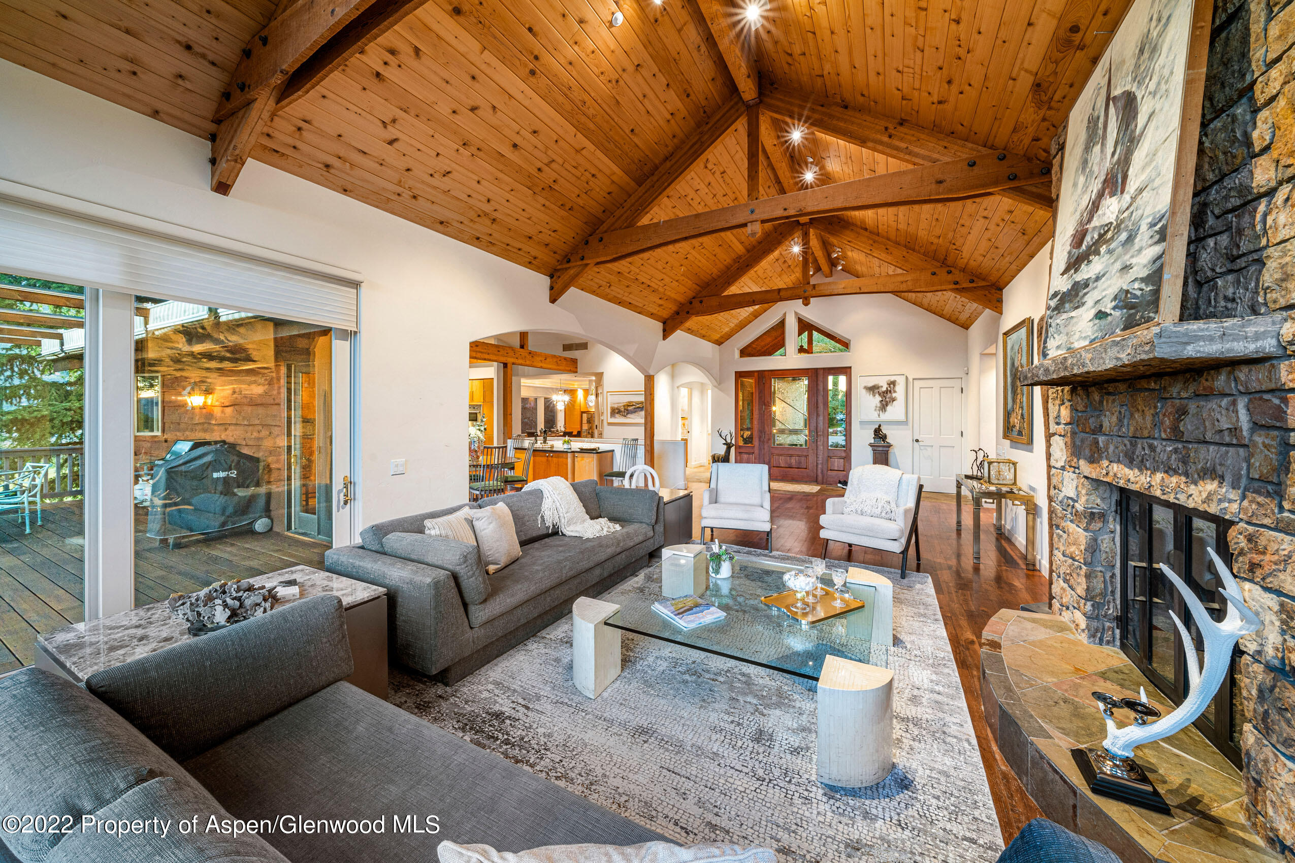 61 Primrose Path Aspen, CO 81611 - Photo 43 of 48 a living room with furniture a fireplace and a table