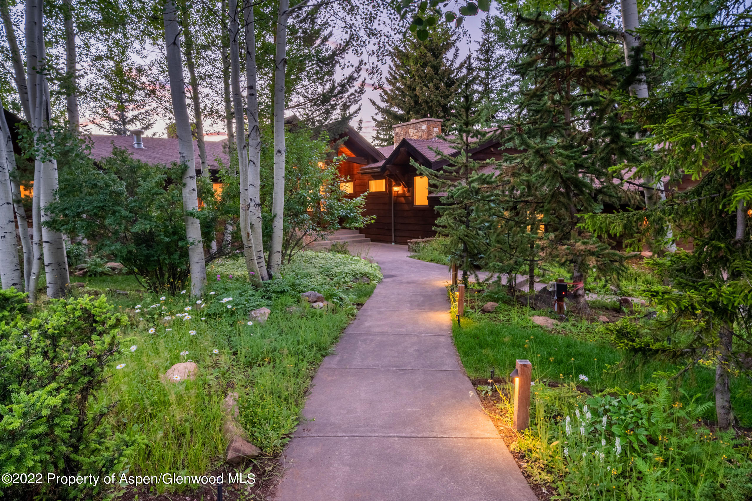 61 Primrose Path Aspen, CO 81611 - Photo 44 of 48 a view of a pathway covered with flower plants