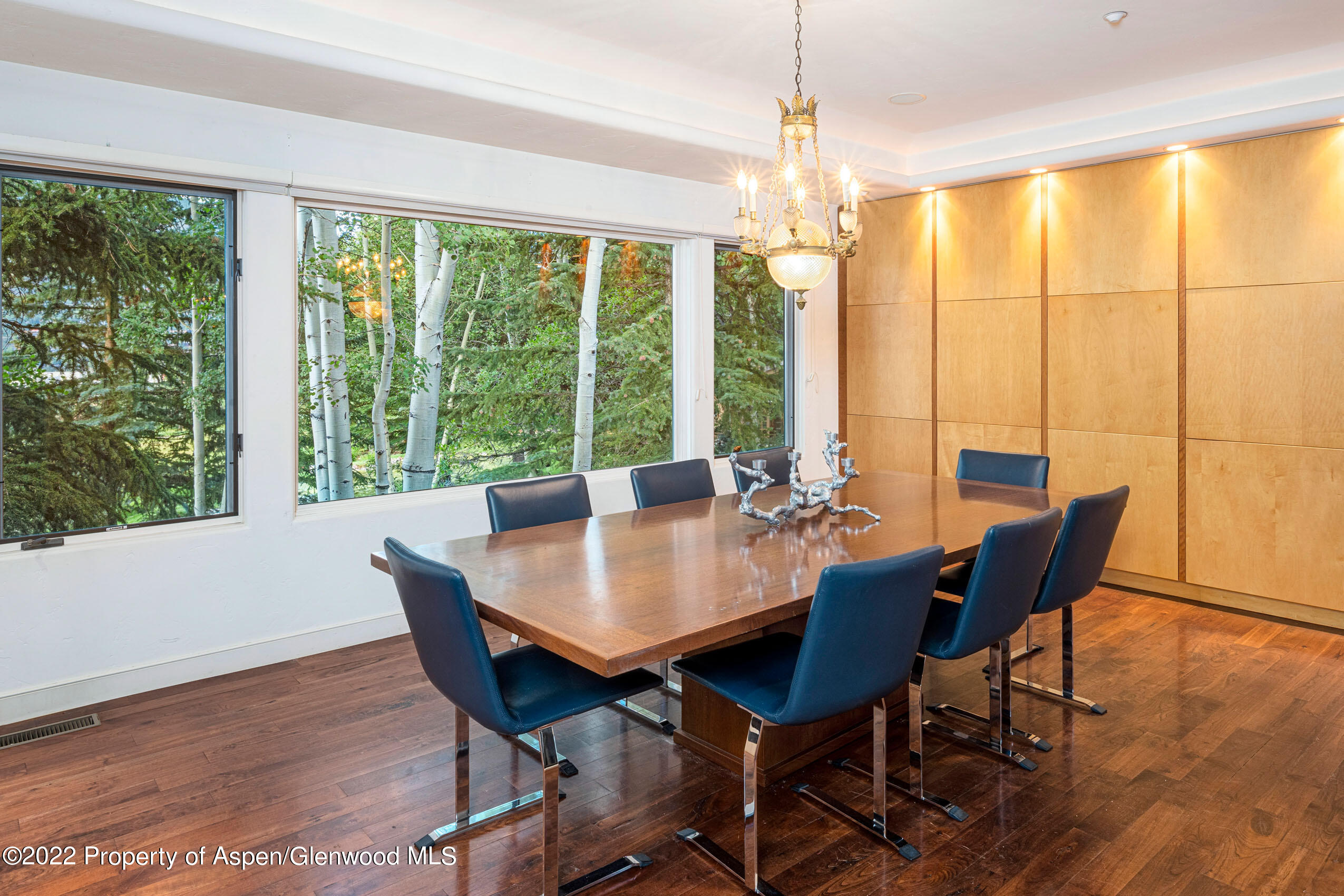 61 Primrose Path Aspen, CO 81611 - Photo 8 of 48 a view of a dining room with furniture window and wooden floor