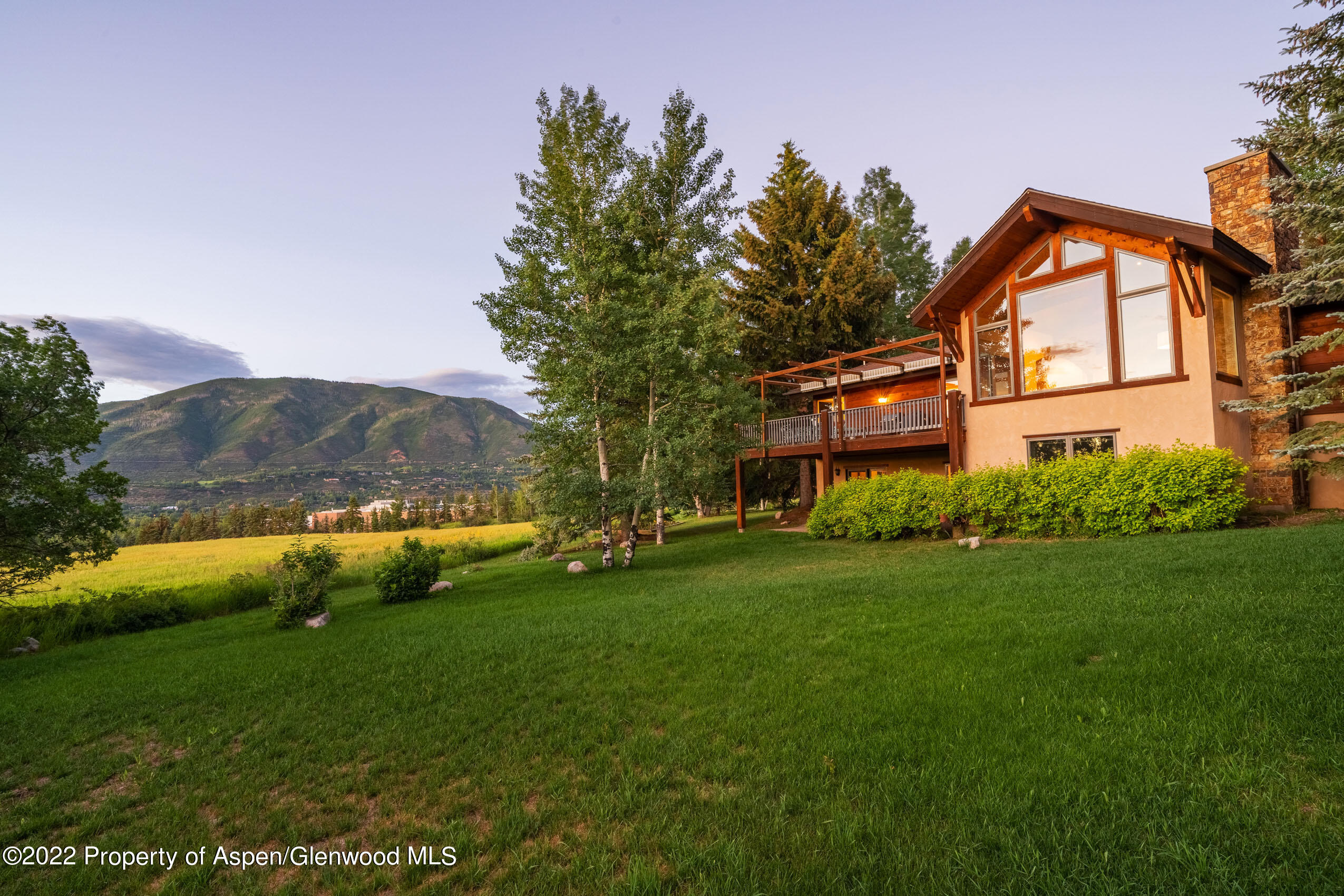61 Primrose Path Aspen, CO 81611 - Photo 10 of 48 a front view of a house with garden