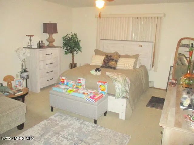 a bed room with a bed and a dresser