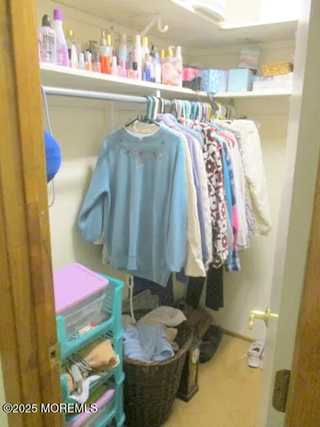 a room with water heater and shelf