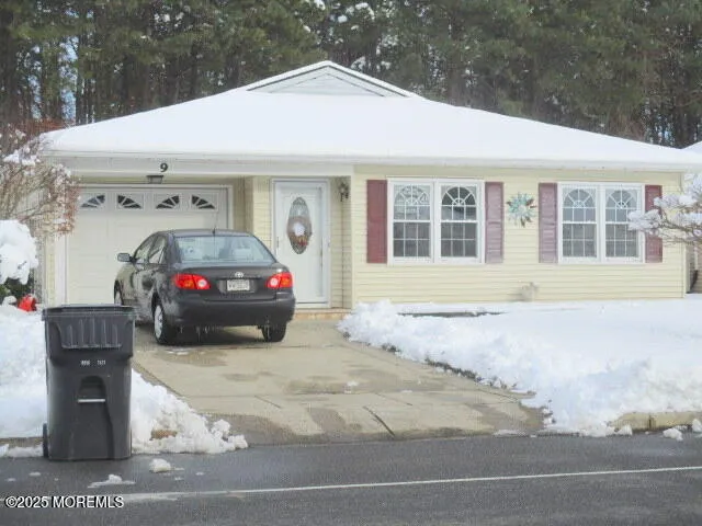 a view of a car park in front of house