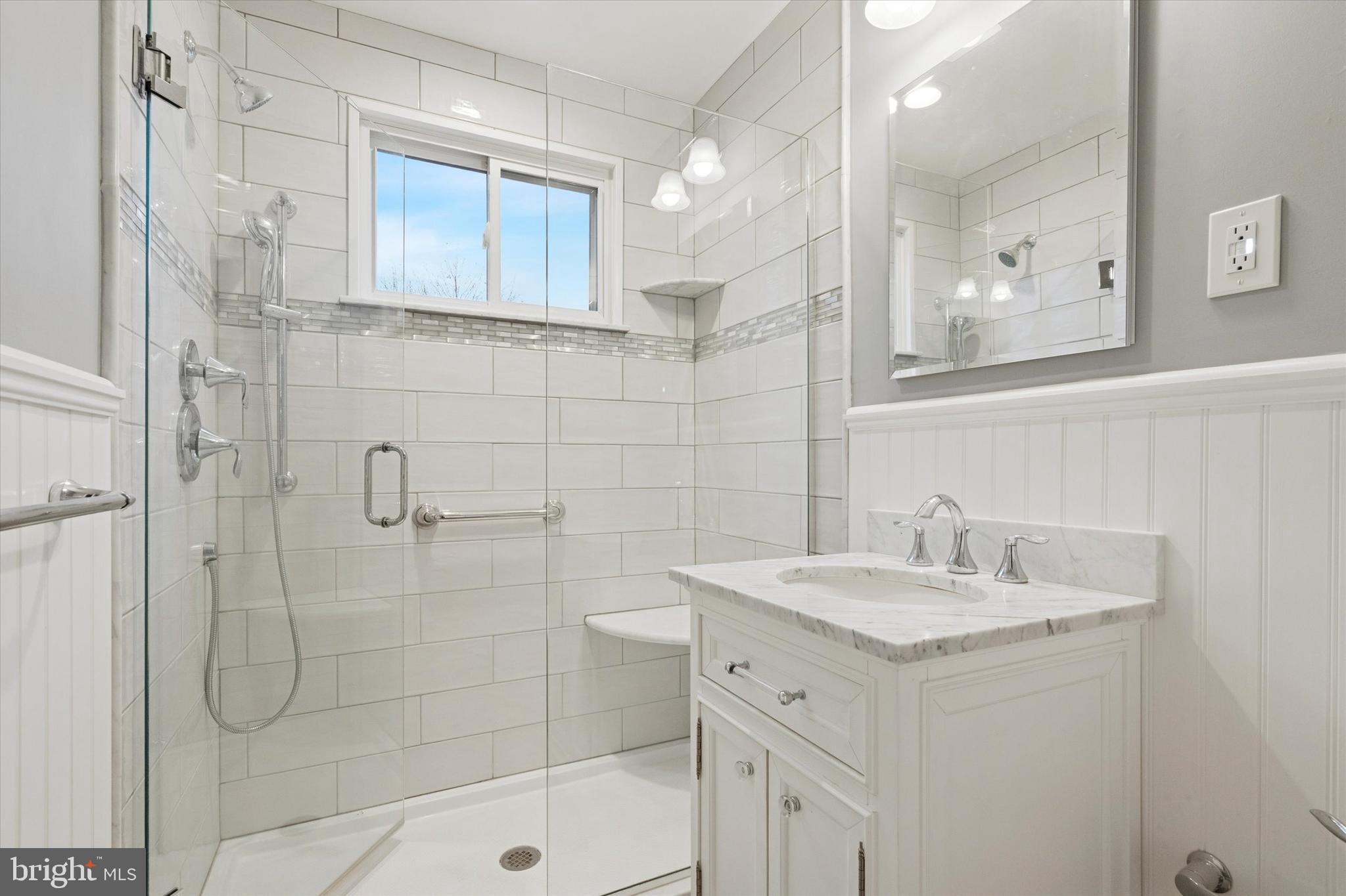 230 South Carol Boulevard, Unit B000 Upper Darby, PA 19082 - Photo 13 of 25 a bathroom with a sink a toilet and shower