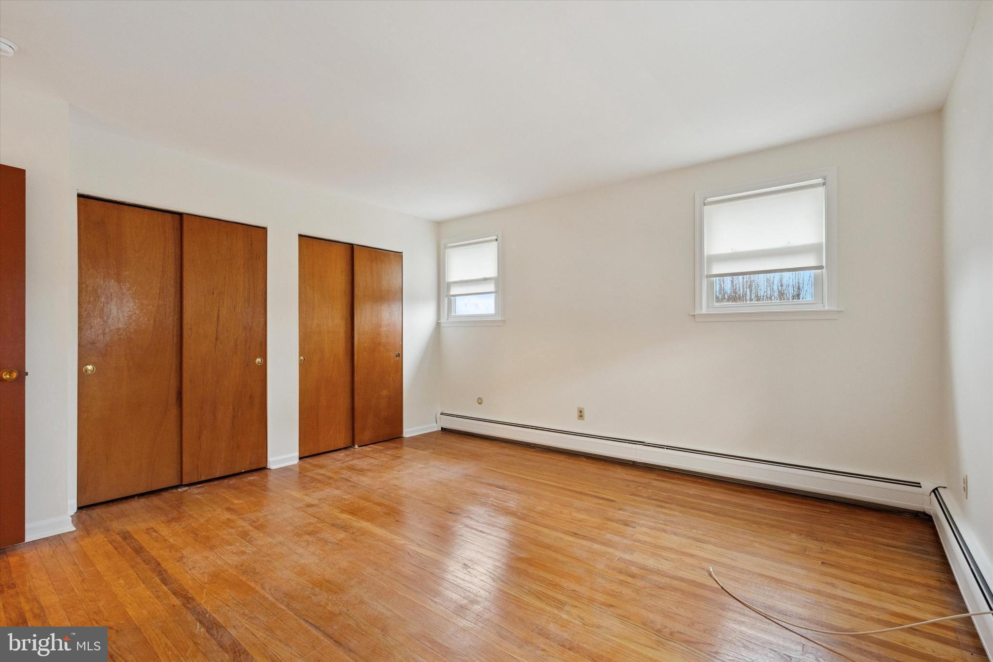 230 South Carol Boulevard, Unit B000 Upper Darby, PA 19082 - Photo 18 of 25 a view of an empty room with wooden floor